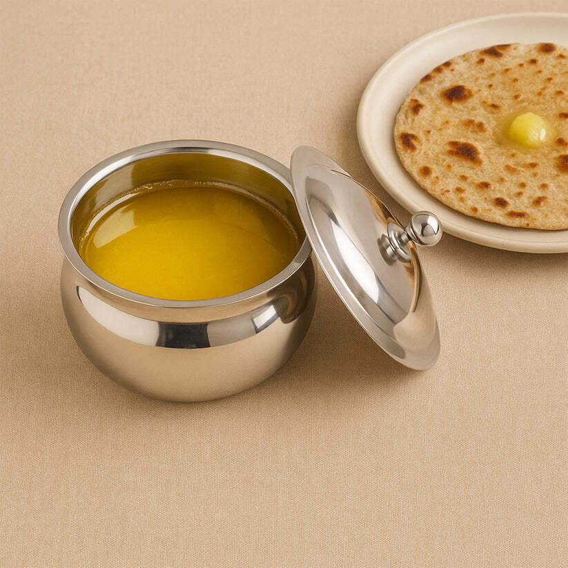 imageedit_0_6165456137 Stainless Steel Ghee Pot with Lid & Spoon – Mirror Finish