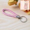 01_03a8e084-faa7-4e29-887c-b07ba34bb4ff.jpg Braided Leather Keychain – Durable Metal Ring & Stylish Hand Strap