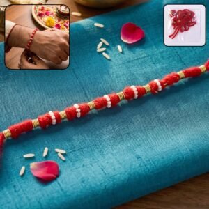 01_af350443-eaf2-409a-8fe8-6fbd5f7c8bc8.jpg Handmade Red Rakhi with White Beads – Traditional Celebration Accessory