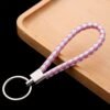 03_4f2dc192-97ab-4293-85e2-2dea8658cd44.jpg Braided Leather Keychain – Durable Metal Ring & Stylish Hand Strap