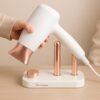 03_91b40e7c-d71f-462d-bbb0-2a11437dd635.jpg Wall Mount Hair Dryer Holder – Space-Saving & Heat Resistant