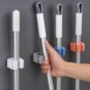 03_broomholder.jpg Wall-Mounted Plastic Broom Holder Clip for Efficient Storage