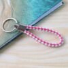 04_5b847559-9f22-4075-b2d6-2a0d2347c130.jpg Braided Leather Keychain – Durable Metal Ring & Stylish Hand Strap
