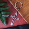 Metal Cross Keychain – Gujarati Jesus Script for Spiritual Style