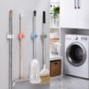 06_broomholder.jpg Wall-Mounted Plastic Broom Holder Clip for Efficient Storage