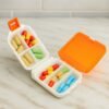 Portable Pill Organizer – Dual-Sided 8 Compartments Orange Box