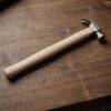17056-03-product_33a14142-f9c9-48d4-8c08-aa8826e41eaf.jpg Wooden Handle Claw Hammer – Durable Steel Head for Carpentry