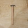 17056-07-live_8f541cb9-6e77-4d02-a6d2-8911a9a70ad2.jpg Wooden Handle Claw Hammer – Durable Steel Head for Carpentry