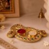 23828-05-white-bg_56329275-fa38-4c34-8e85-cba0b14ecd9a.jpg Golden Kumkum Kankavati Holder – Elegant Pooja Organiser