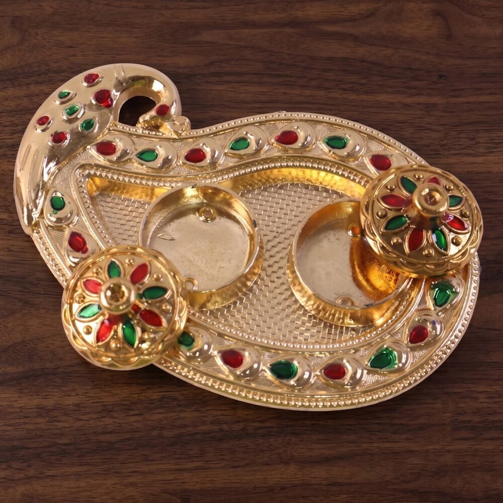 23828-07-live_254ddc6d-69f4-4422-9117-40210ba5ffca.jpg Golden Kumkum Kankavati Holder – Elegant Pooja Organiser
