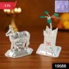 3e869815-ee96-4c83-abc6-6cdf0ca731eb.jpg Kamdhenu Cow & Tulsi Plant Silver-Plated Pair – Divine Pooja Décor