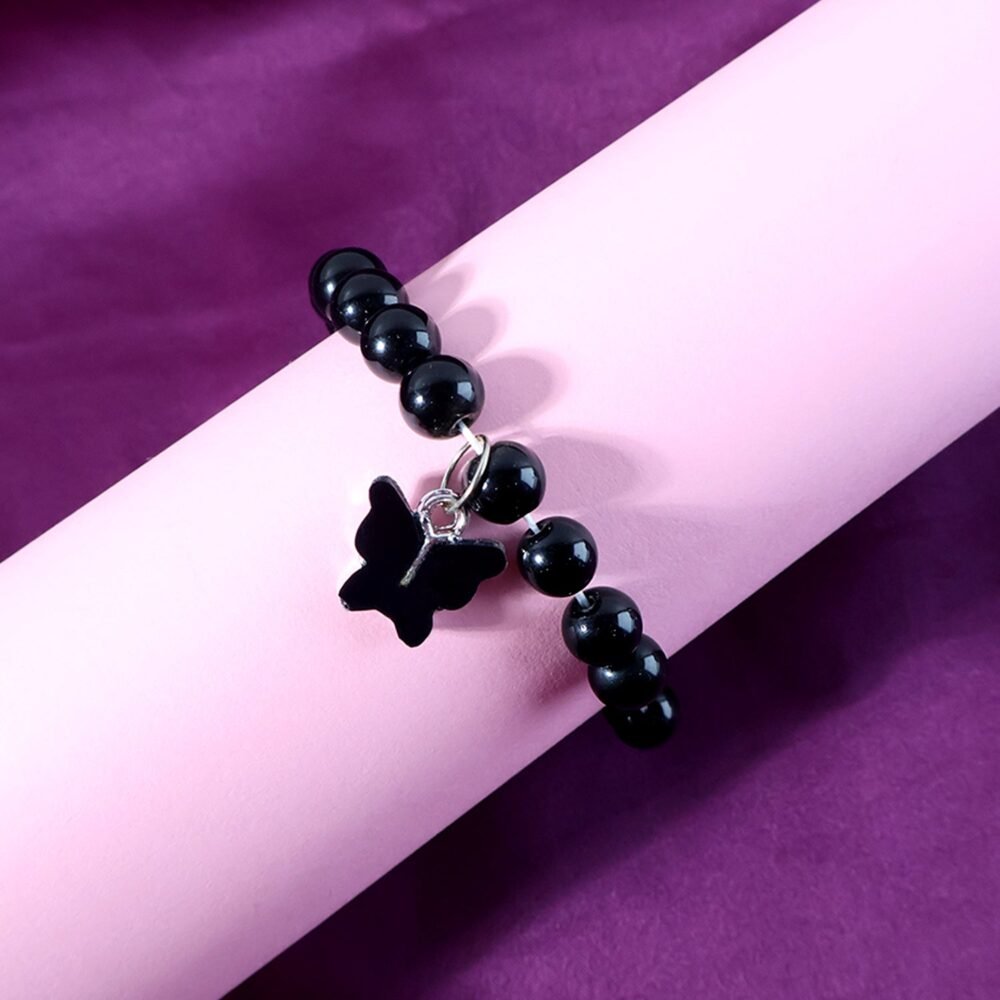 Bracelet-02_0460de35-771b-4e38-aff1-667b4598992d.jpg Beaded Bracelet with Butterfly Charm – Elegant Stretch Wristwear