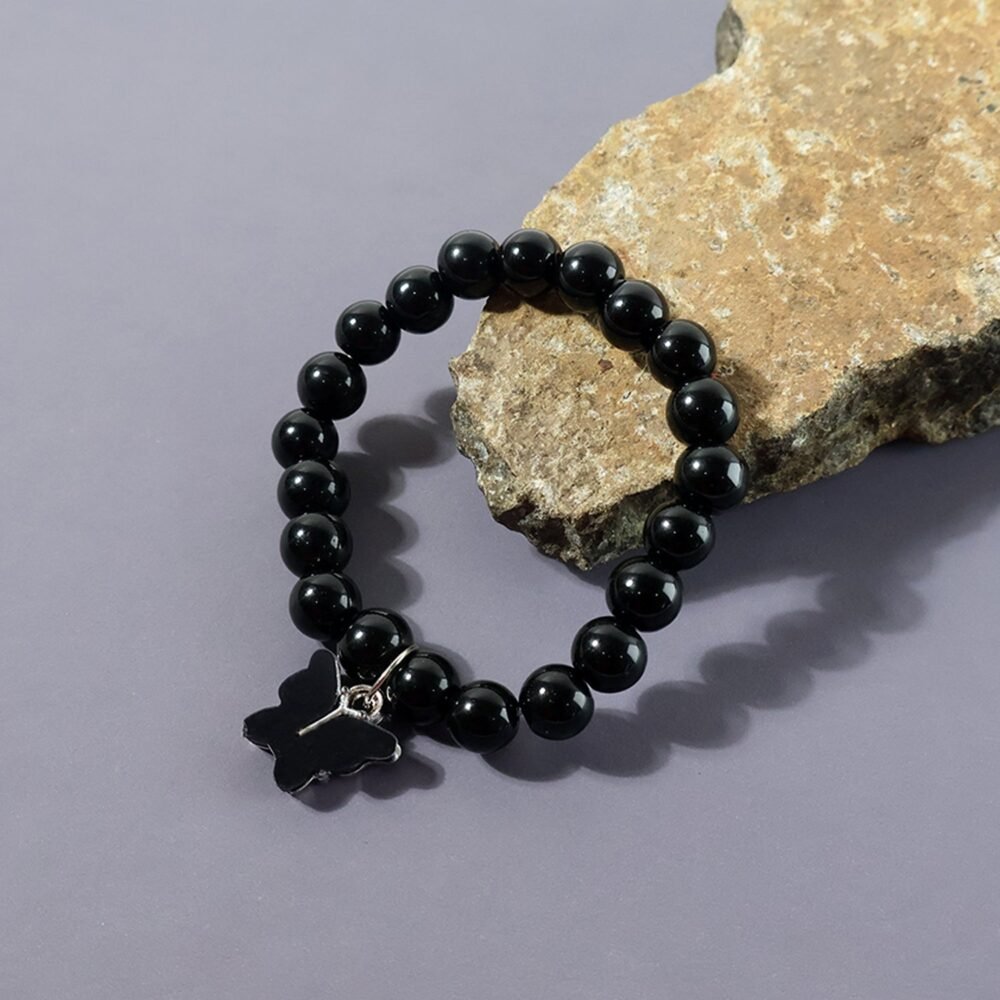 Bracelet-03_f9dda4ab-76dc-4189-91af-2dd2d569f354.jpg Beaded Bracelet with Butterfly Charm – Elegant Stretch Wristwear