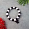 Black & White Beaded Bracelet with Cross Pendant – Elegant Style