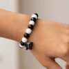 Black & White Beaded Bracelet with Cross Pendant – Elegant Style