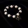 Black & White Beaded Bracelet with Cross Pendant – Elegant Style