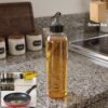 PlasticOilDispenser-WOSKU-01.jpg Oil Dispenser Bottle with Flip Top Spout – 900ml, Leakproof & Easy to Use