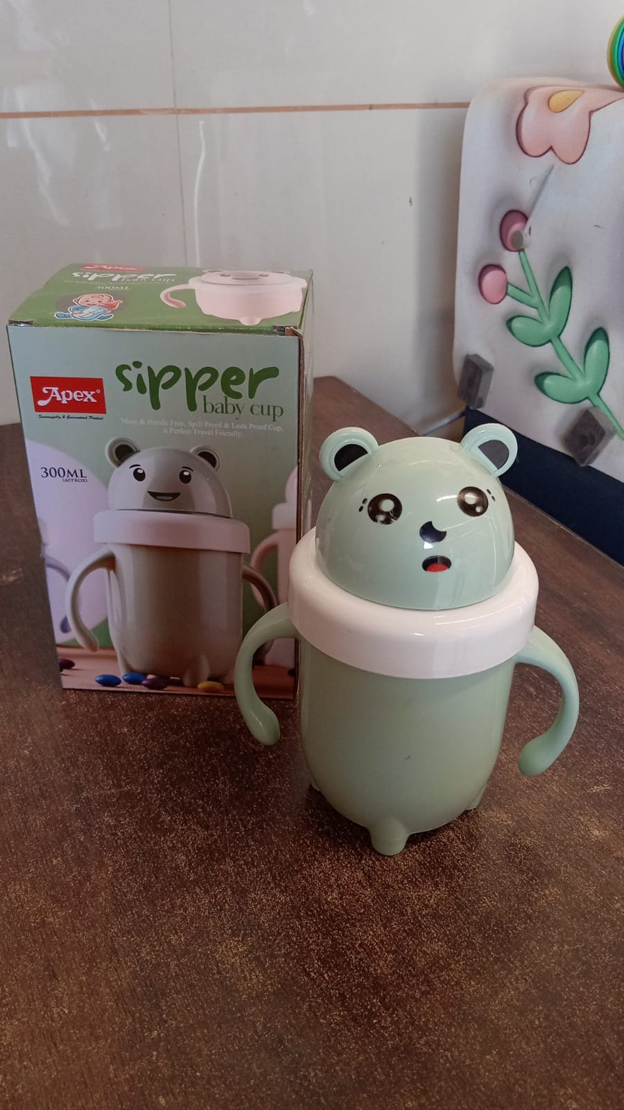 bd6d18b1-6eec-47bf-8ec5-d0823894f0ca.jpg Sipper Baby Training Cup – Leak & Spill Proof 300ML Handle Design