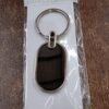 Oval Metal Keychain – Elegant Black & Silver Finish for Everyday Use