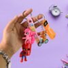 Keychains-02_02110ef1-5dab-428a-8ec4-62766d391df3.jpg Cartoon Silicone Keychain – Cute 3D Character Bag Charm for Kids | Styleva